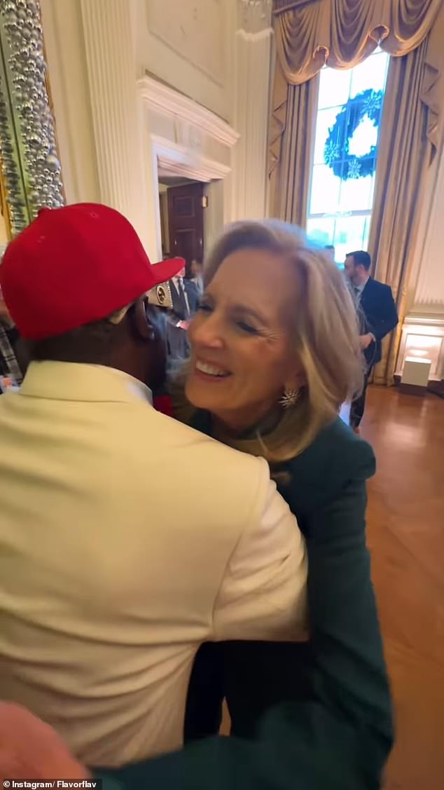 Jill Biden gives Flavor Flav a hug