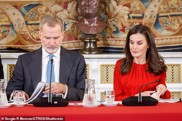 Letizia appeared in high spirits as she sat down with the charity's board of trustees in the Spanish capital.