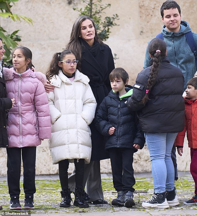 The kind queen took the time to speak to a group of children outside the monastery before entering to preside over the closing ceremony.