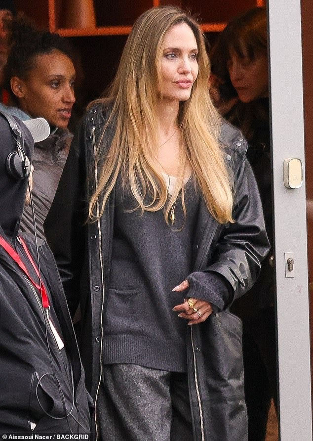 The actress was spotted mingling with crew members as she left a wig shop in Paris between takes