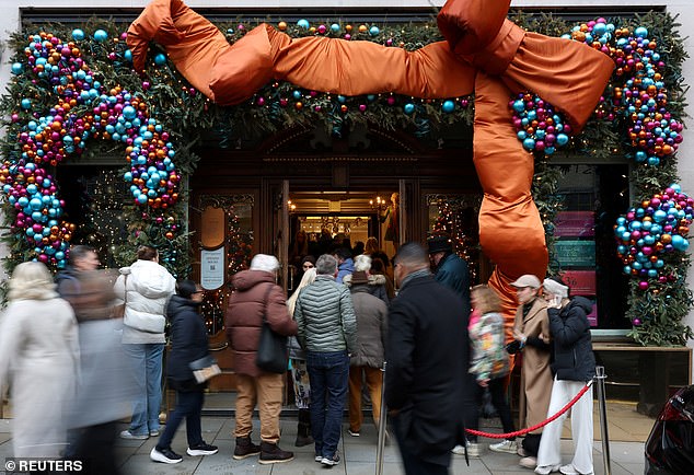 Shoppers are pictured entering the Fortnum and Mason store in London earlier this week.