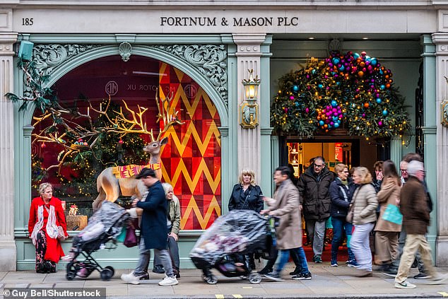 Fortnum & Mason on Piccadilly, busy with shoppers enjoying its festive window displays