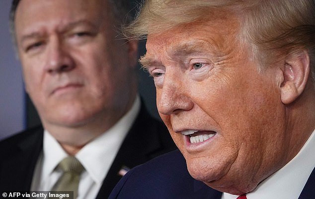 US Secretary of State Mike Pompeo listens as US President Donald Trump speaks during a press conference