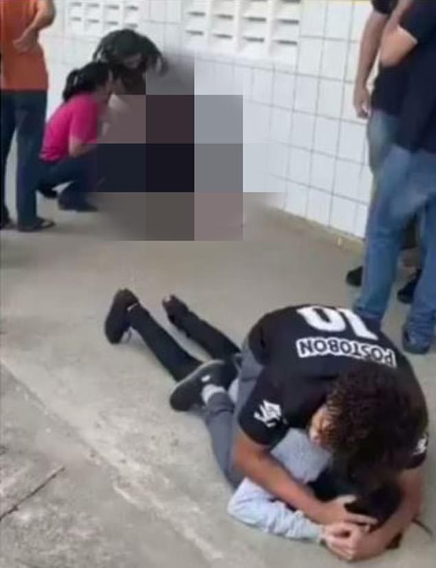 A student restrained Lyedja Santos (below right) while teachers treated a wounded classmate (above left) who was shot in the head by Santos.