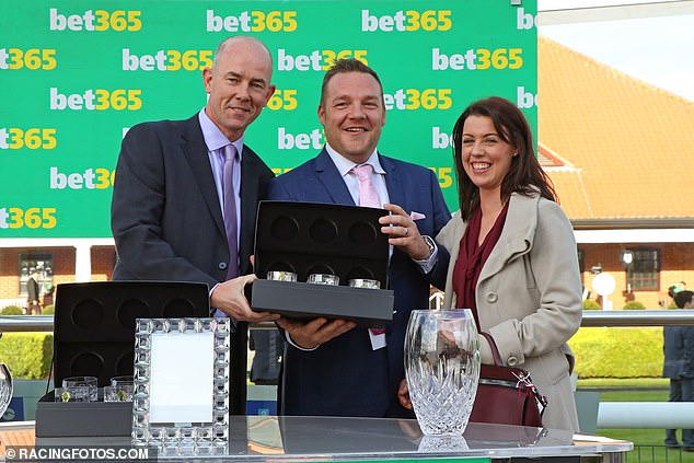 John Dance (centre) accepting a trophy in Newmarket after his horse Laurens was the winner