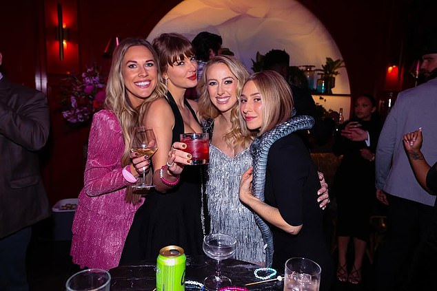 Kelce (far right) could be seen in the background of one of the photos from the dazzling party.