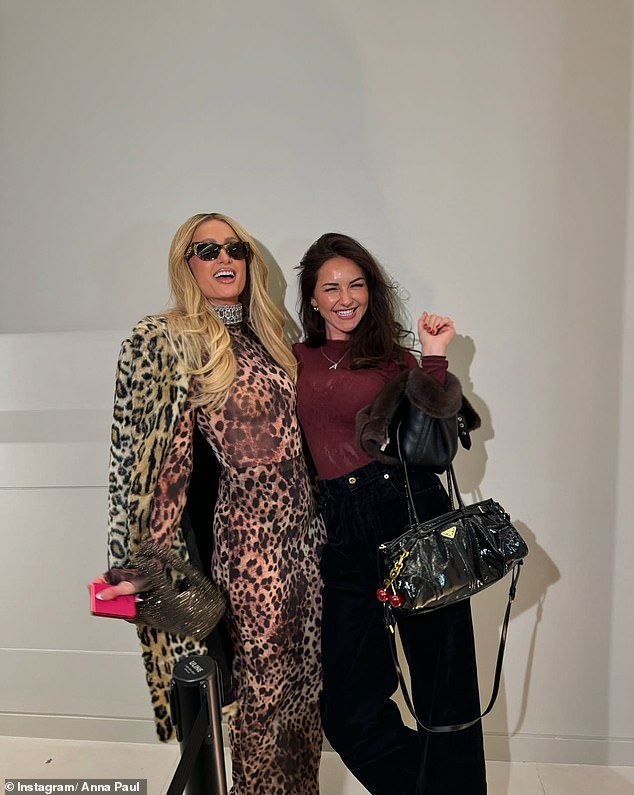 She shared a photo with Paris Hilton, who wore a sexy leopard-print ensemble, complete with a tight-fitting top, a figure-hugging skirt, and a coat. Both in the photo