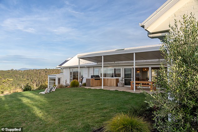 The L-shaped home has a lush private backyard.