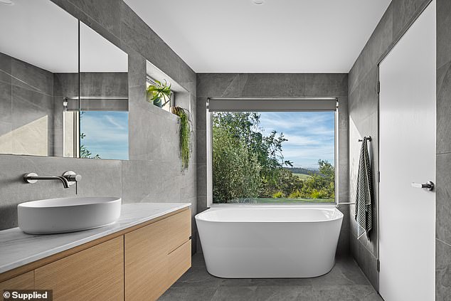 The master bathroom tub is deep, luxurious and has a great view.