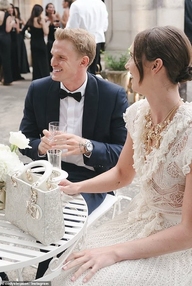 The couple exuded old Hollywood elegance, with Simpson looking the dapper date in a classic black tuxedo.