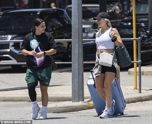 The happy couple, who announced they were expecting their first child last month, were all smiles as they walked through the arrivals gate at Perth Airport on Thursday.