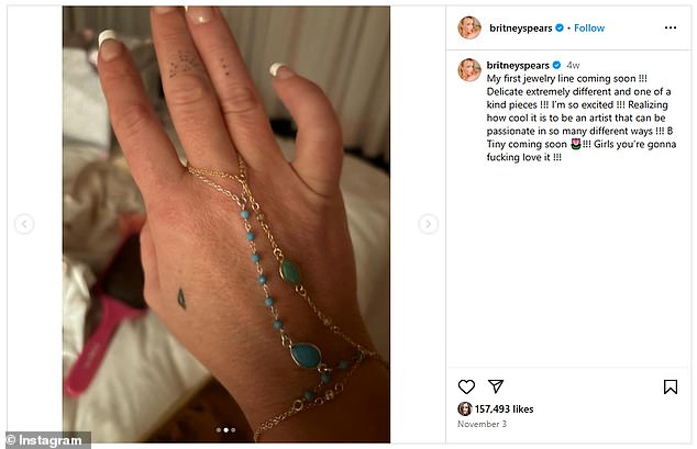 Britney showed an image of what appeared to be her own hand wearing a silver chain with a series of turquoise stones and another gold chain with a green stone on top of her silver piece.