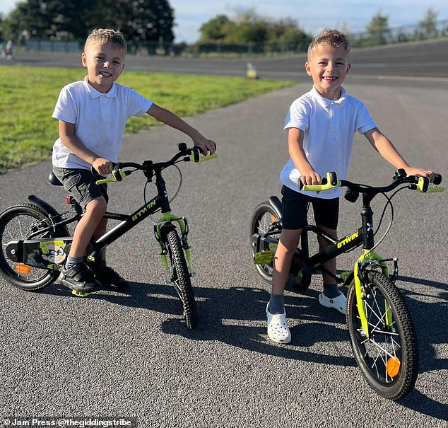 The twins, Hezekiah and Levi, riding second-hand bicycles.