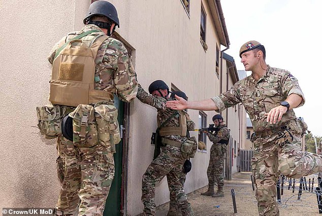 British troops have trained more than 51,000 Ukrainian soldiers since 2022. Pictured, a British soldier teaches Ukrainian recruits how to storm a building.