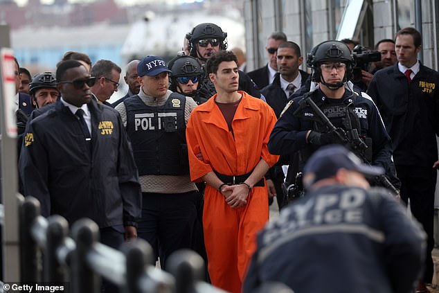 Mangione arrives at a heliport with members of the NYPD on December 19 before his arraignment