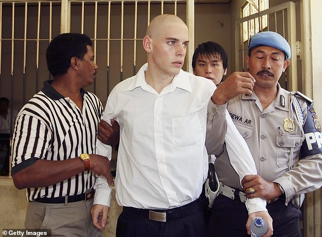 Norman, the youngest member of the Bali Nine, was just 18 years old when he was arrested. In the photo he is accompanied to his sentencing trial in Bali in 2006.