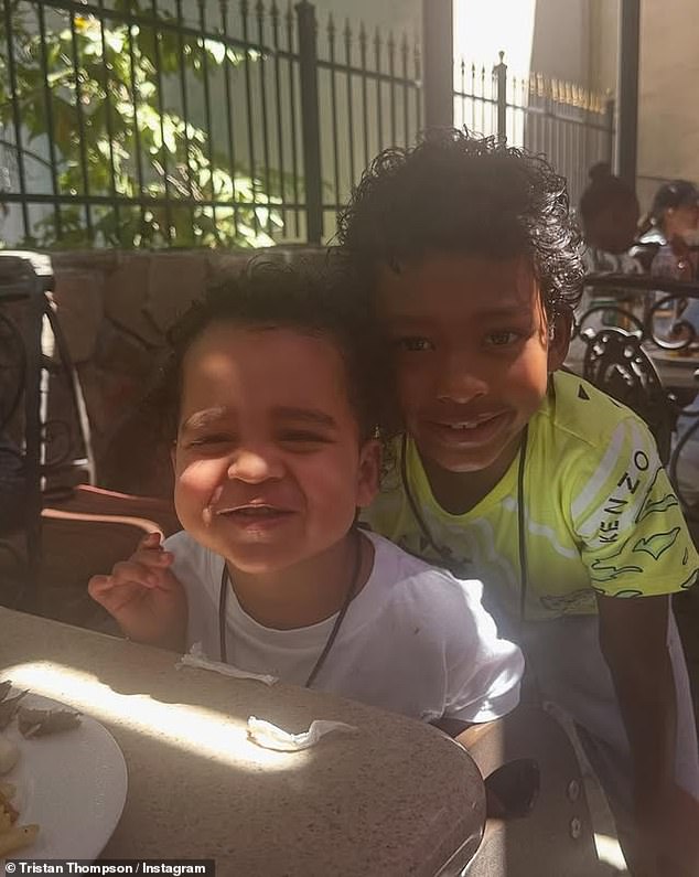 Tatum and Theo smile as they enjoy lunch.