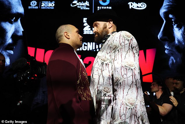 The pair had to be removed after going toe to toe for over ten minutes at the final press conference before their heavyweight rematch.