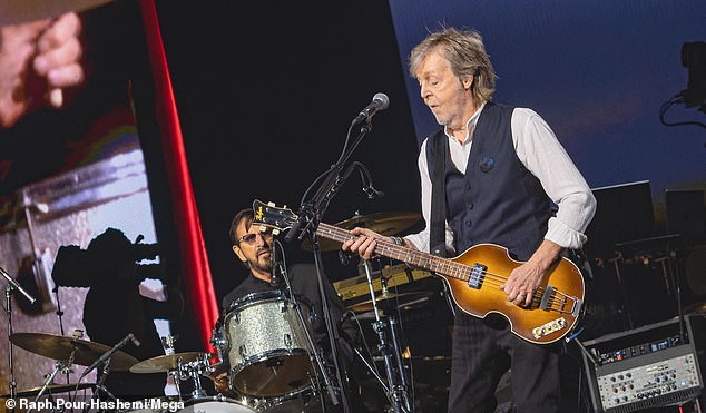 Paul came on stage playing guitar while raising Ringo to play drums with him.