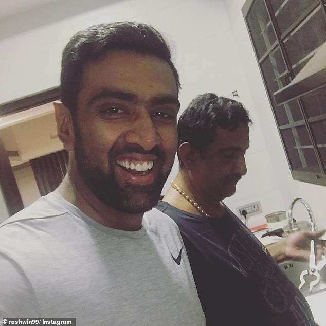 Ashwin's father (pictured right with the star) believes his son might have quit due to the 'humiliation' of not being selected.