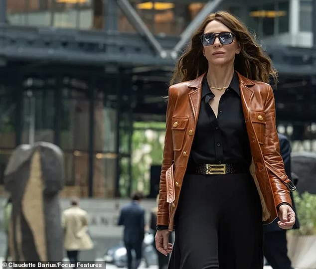 The actress looks almost unrecognizable in upcoming spy thriller Black Bag (pictured), with her signature platinum bob replaced by long brunette locks.