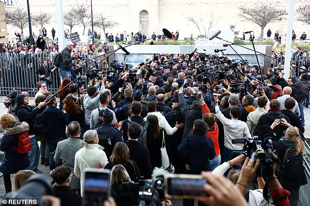 Frenchwoman Gisele Pelicot, victim of an alleged mass rape orchestrated by her then-husband Dominique Pelicot in their home in the city of Mazan, in the south of France, leaves the court surrounded by French police and journalists after the verdict in the trial against Dominique Pelicot and 50 co-defendant, in Avignon, France, December 19, 2024