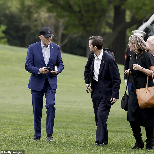 The influence on Biden was 'concentrated by people who are not outward-looking', including his close adviser Bruce Reed (pictured with Biden in April)