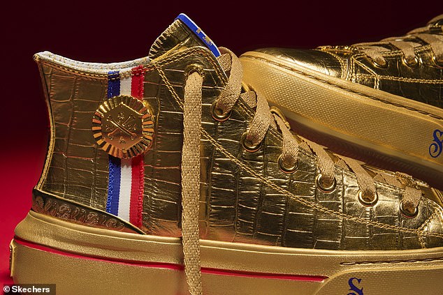 Made from embossed gold leather, the shoe features gold laces and a ribbon in the colors of the French flag.