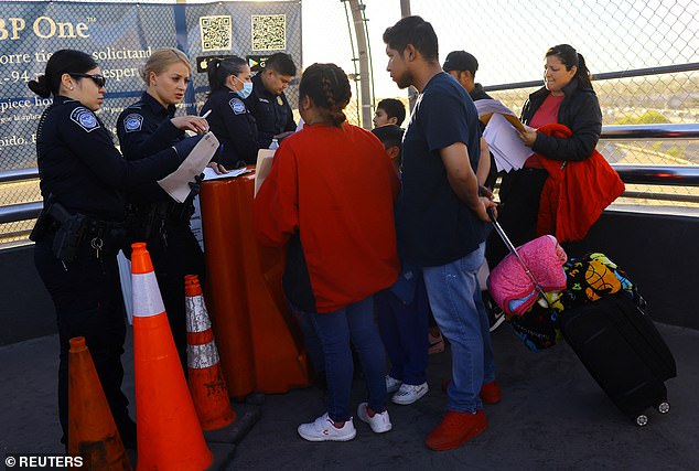 Migrants seeking asylum in the United States who previously requested an appointment through the CBP One application attend their appointment