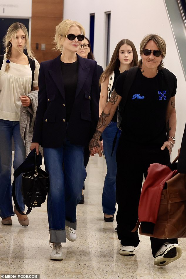 Nicole was seen landing at Sydney International Airport with her husband Keith Urban and their two daughters Sunday Rose, 16, and Faith Margaret, 14 (all pictured).