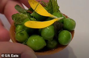 A mini mound of peas on a puff pastry type base.