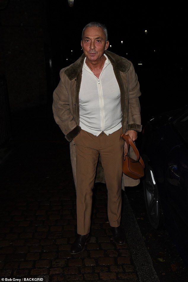 Bruno Tonioli looked dapper in brown pants and a white zip-up jacket, complete with a fur jacket.