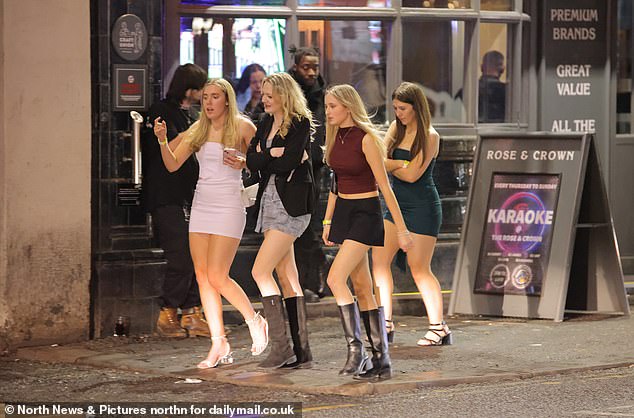 NEWCASTLE: Four friends in their Christmas best as revelers hit the town on Black Eye Friday