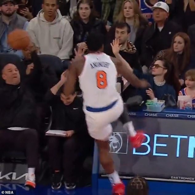 She was photographed sitting courtside when the 6-foot-7 NBA player, 27, charged in her direction while chasing the ball in a game between the New York Knicks and the Chicago Bulls.