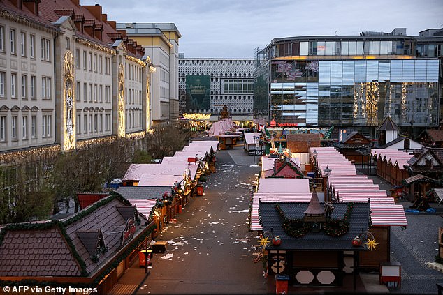 Debris and closed stalls are seen on Saturday at the scene of a car ram attack at a Christmas market in Magdeburg