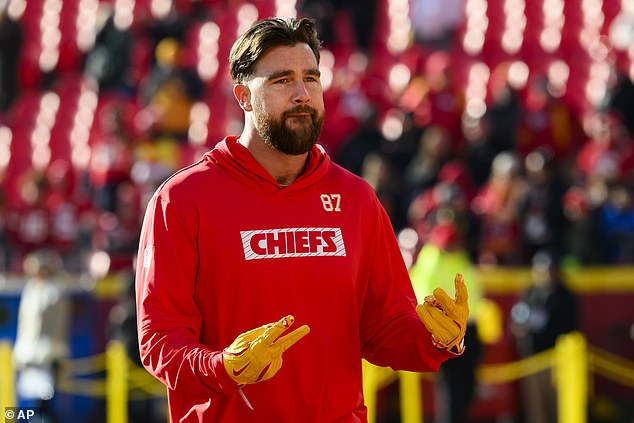 Kelce is seen warming up before the Chiefs-Texans game on Saturday afternoon