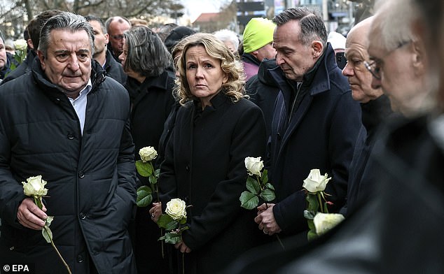 The chancellor and his ministers laid a white rose at a church before leaving the scene