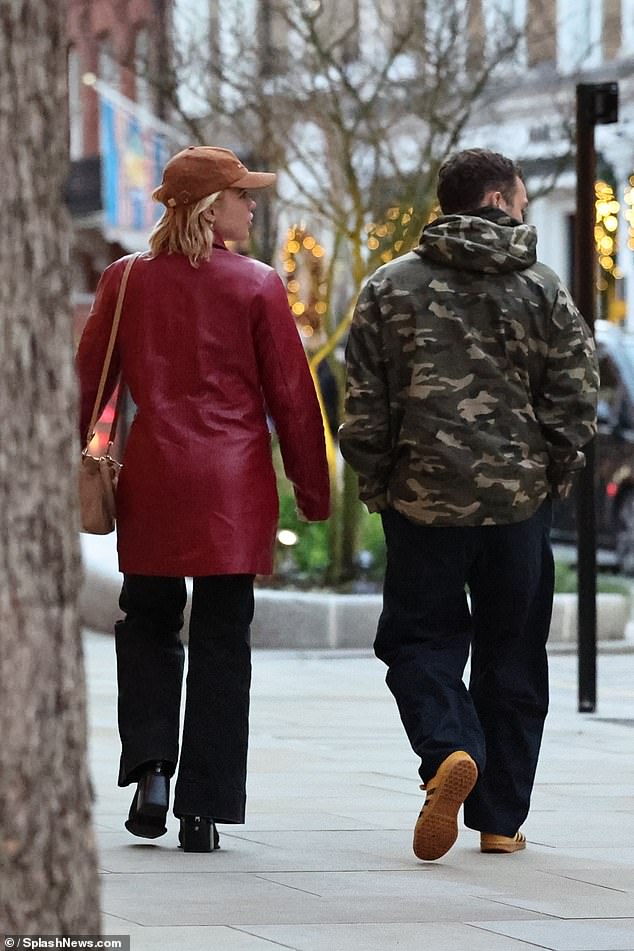 The We Live In Time star put on a typically fashionable display as she was wrapped in a red leather coat and black wide-leg jeans.