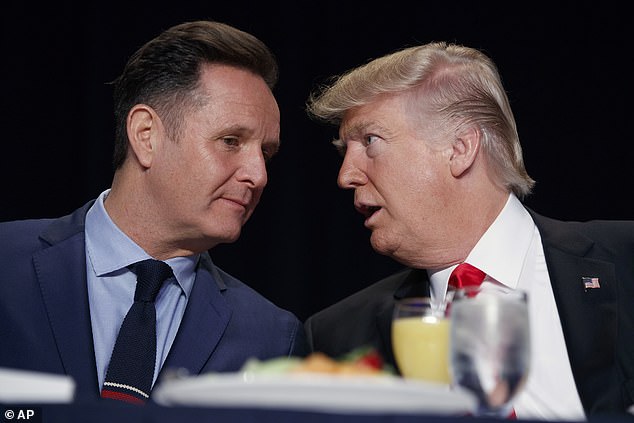 Mark Burnett (left) has described himself as 'Robin' to Donald Trump's 'Batman' (right).