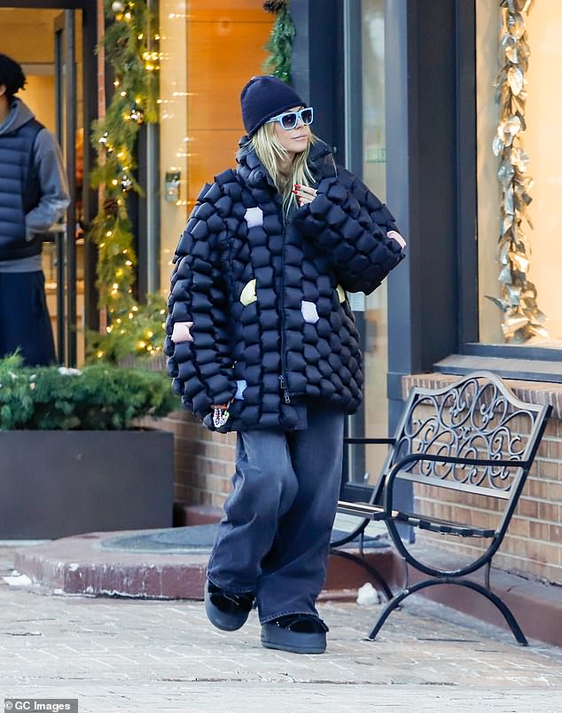 The America's Got Talent judge was bundled up for the outing in Colorado as she wore a quirky oversized black and multi-color quilter coat over a pair of baggy black jeans and chunky snow boots.