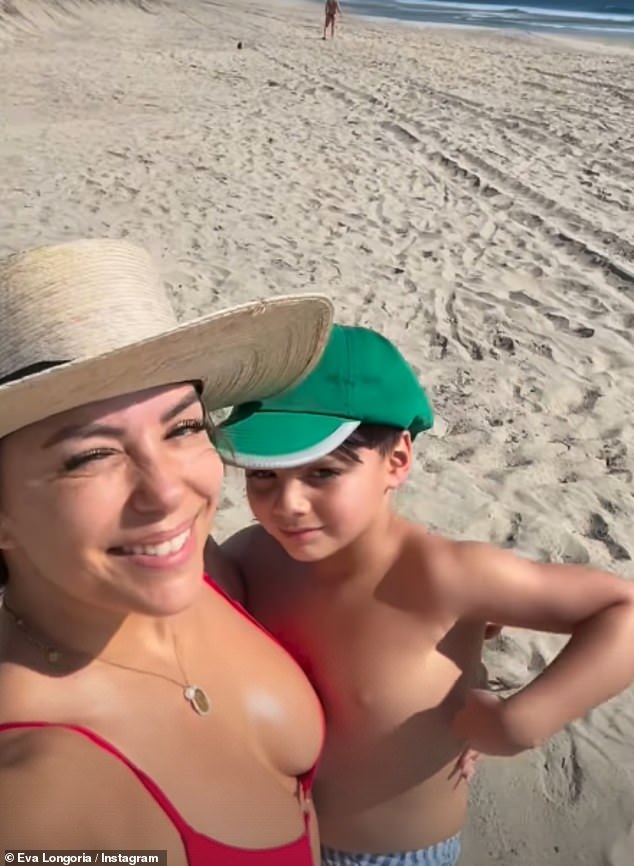 In clips shared on her Instagram Story, Eva carried Santiago in her arms as they walked on the beach and The Desperate Housewives star looked gorgeous as she shielded her eyes with a wide-brimmed cream cap.