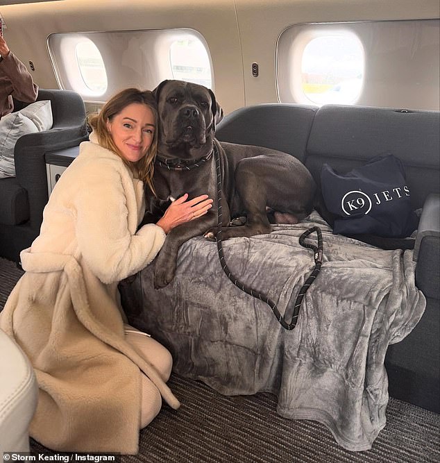 The snaps included Storm lying on a plush double bed on board the plane with her dog, as well as cuddling with him on the seats.