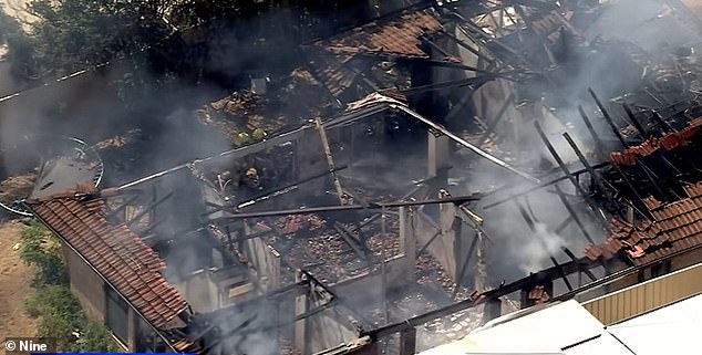 It took firefighters about 40 minutes to bring the fire under control, but not before it destroyed the house and collapsed the roof (pictured).