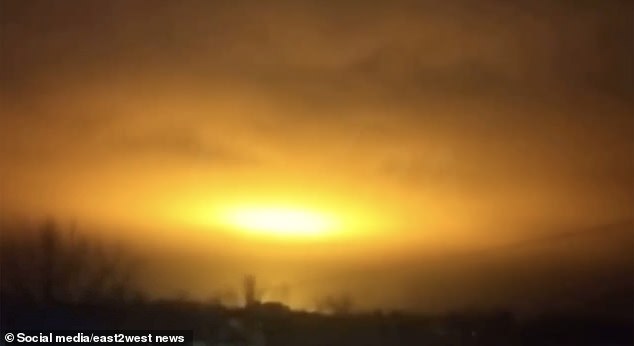 The video showed the sky lit up in vivid, apocalyptic yellow and orange colors as air defenses attempted to defend the strategic oil depot.