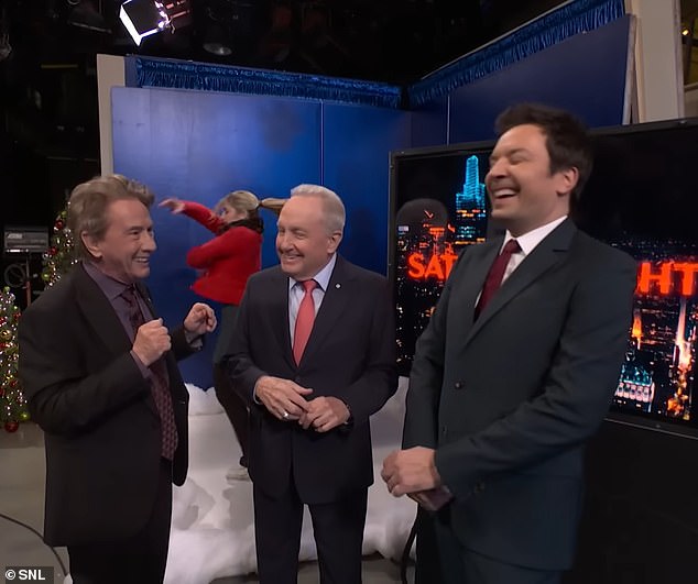 The jokes - which also almost made fun of AG Matt Gaetz and Robert F Kennedy - gave way to a satirical performance of the popular holiday song 'We Need a Little Christmas', and a surprise appearance from Lorne Michaels (centre) and Jimmy Fallon.