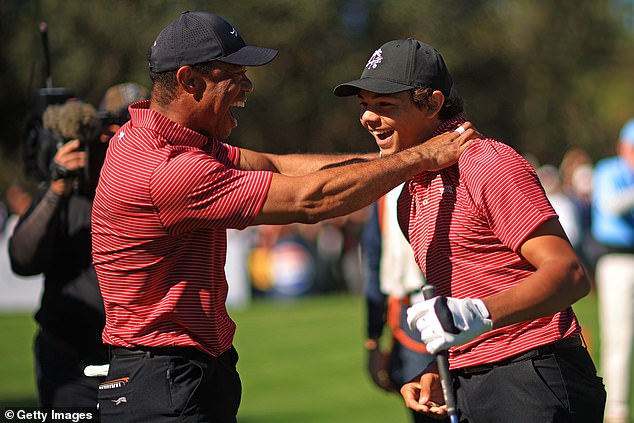 Tiger was the first on the scene celebrating with his son after holeing from the tee box