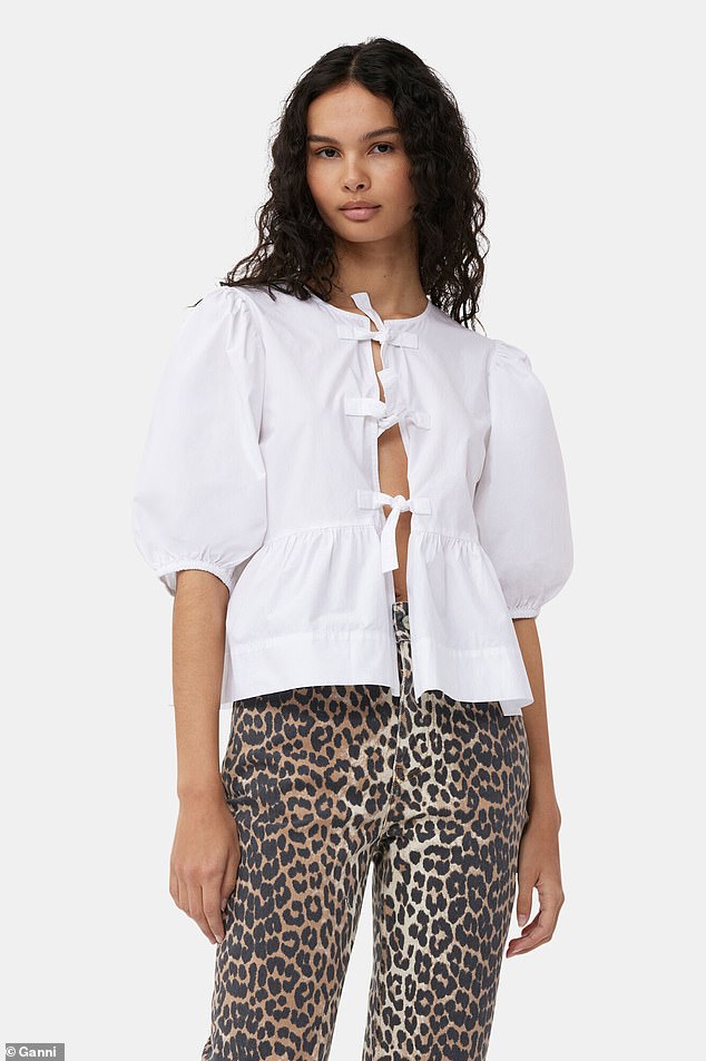 Ganni's Cotton Poplin Bow Blouse, priced at $295, is made from certified organic cotton and offers a sleek, relaxed fit.