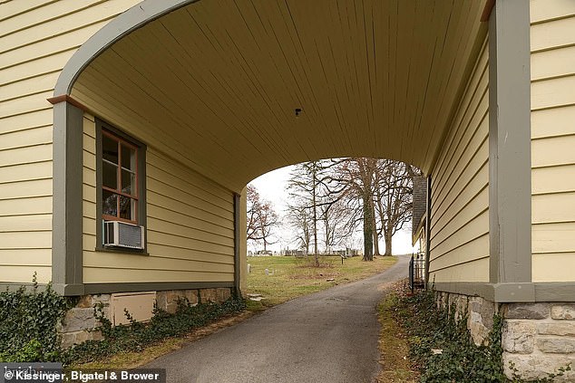 While undeniably charming, its location as a former cemetery gatehouse adds a hauntingly unique aspect to the home's appeal.