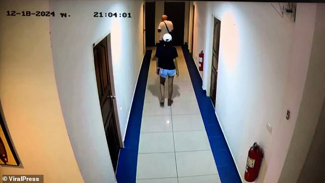 CCTV footage obtained by police shows Duangta wearing a black shirt and a white cap walking with the tourist through the hotel corridor on the night of December 18.