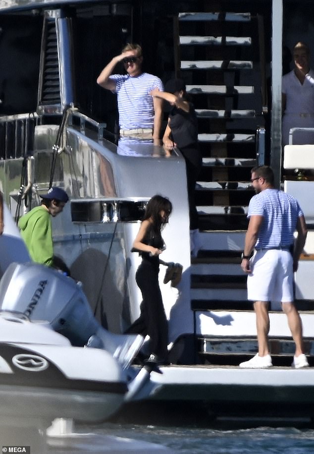 Members of the yacht's crew were seen helping the family on the trip.